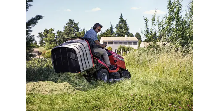HF Ride On Mower Model Dumping Grass.webp